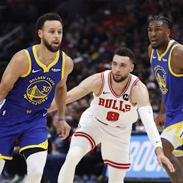 Jan 12, 2024; Chicago, Illinois, USA; Golden State Warriors guard Stephen Curry (30) dribbles against Chicago Bulls guard Zach LaVine (8) during the first half at United Center. Mandatory Credit: Kamil Krzaczynski-Imagn Images