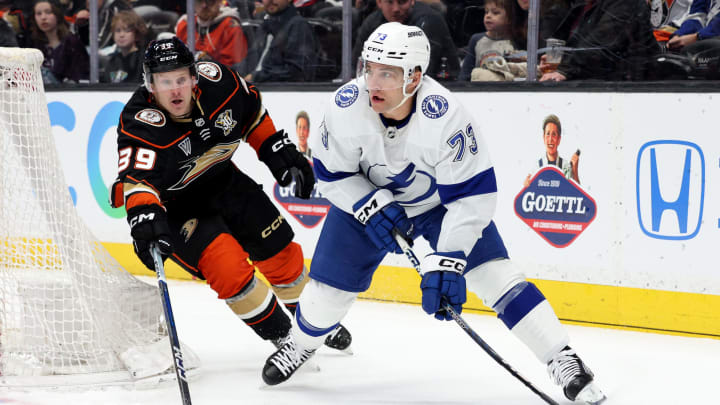 Mar 24, 2024; Anaheim, California, USA; Tampa Bay Lightning left wing Conor Sheary (73) passes from Anaheim Ducks center Ben Meyers (39) during the first period at Honda Center. Mandatory Credit: Jason Parkhurst-USA TODAY Sports