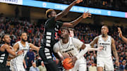 Feb 17, 2024; Orlando, Florida, USA; UCF Knights forward Ibrahima Diallo (11) drives to the basket against Cincinnati Bearcats forward Aziz Bandaogo (55) during the second half at Addition Financial Arena. Mandatory Credit: Mike Watters-Imagn Images
