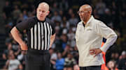 Mar 5, 2025; Orlando, Florida, USA; UCF Knights head coach Johnny Dawkins talks with an official during the first half against the Oklahoma State Cowboys at Addition Financial Arena. Mandatory Credit: Mike Watters-Imagn Images