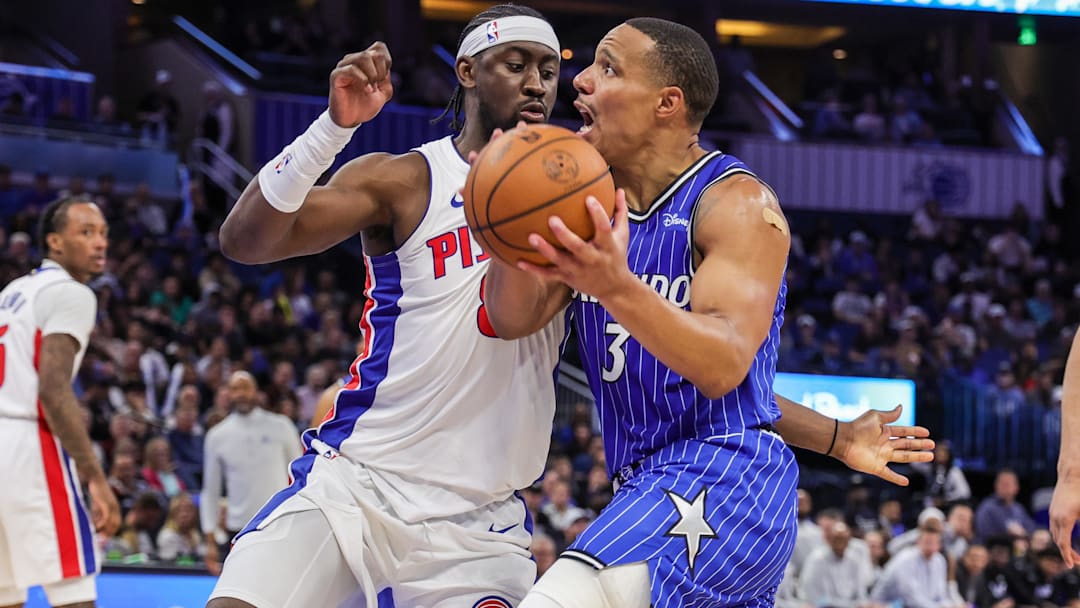Mar 1, 2026; Orlando, Florida, USA; Orlando Magic guard Desmond Bane (3) is fouled by Detroit Pistons guard Caris LeVert (8) during the second half at Kia Center. Mandatory Credit: Mike Watters-Imagn Images