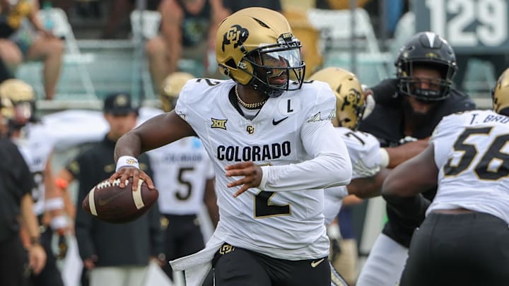 Sep 28, 2024; Orlando, Florida, USA; Colorado Buffaloes quarterback Shedeur Sanders (2) rolls out to pass against the UCF Knights during the first quarter at FBC Mortgage Stadium. Mandatory Credit: Mike Watters-Imagn Images Sep 28, 2024; Orlando, Florida, USA; Colorado Buffaloes quarterback Shedeur Sanders (2) rolls out to pass against the UCF Knights during the first quarter at FBC Mortgage Stadium. Mandatory Credit: Mike Watters-Imagn Images