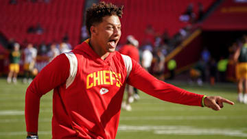 Aug 25, 2022; Kansas City, Missouri, USA; Kansas City Chiefs quarterback Patrick Mahomes (15) laughs after catching a pass over tight end Travis Kelce (not pictured) during warm ups before a preseason game against the Green Bay Packers at GEHA Field at Arrowhead Stadium. Mandatory Credit: Denny Medley-Imagn Images