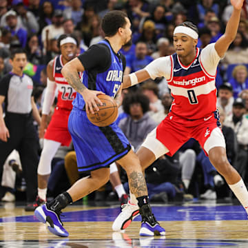 Washington Wizards guard Bilal Coulibaly (0) defends Orlando Magic guard Cole Anthony (50) during the second quarter at Kia Center.