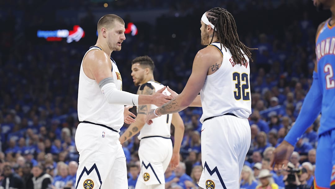 May 18, 2025; Oklahoma City, Oklahoma, USA; Denver Nuggets center Nikola Jokic (15) and Denver Nuggets forward Aaron Gordon (32) celebrate after a play against the Oklahoma City Thunder in the first quarter during game seven of the second round for the 2025 NBA Playoffs at Paycom Center. Mandatory Credit: Alonzo Adams-Imagn Images