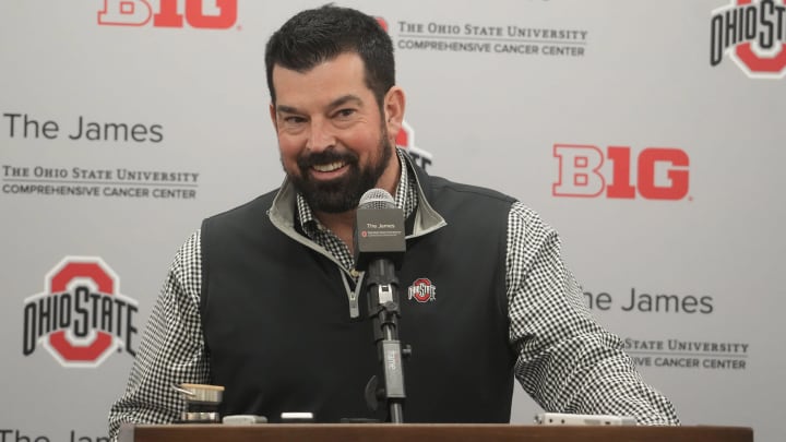Dec 20, 2023; Columbus, Ohio, USA; Ohio State football coach Ryan Day smiles while reacting a question about the whims of high-school recruits. He held a news conference Wednesday, December 20, 2023 to discuss the class.
