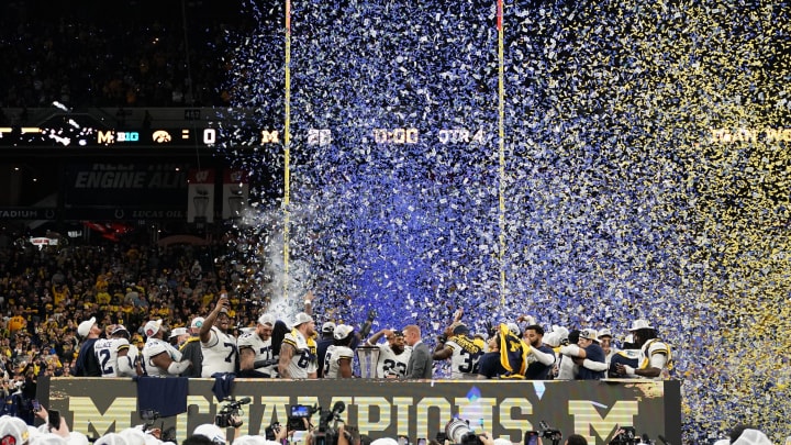 Dec 2, 2023; Indianapolis, IN, USA; Michigan Wolverines celebrate after winning the Big Ten Championship game against the Iowa Hawkeyes at Lucas Oil Stadium.