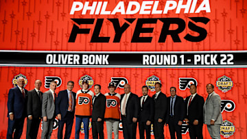 Jun 28, 2023; Nashville, Tennessee, USA; Philadelphia Flyers draft pick Oliver Bonk stands with Flyers staff after being selected with the twenty-second pick in round one of the 2023 NHL Draft at Bridgestone Arena.