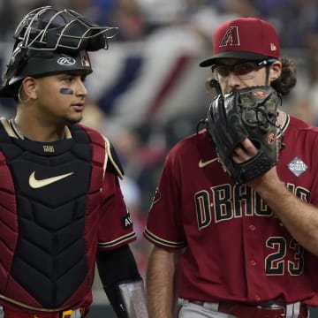 Oct 27, 2023; Arlington, TX, USA; Arizona Diamondbacks catcher Gabriel Moreno (14) and pitcher Zac Gallen (23) talk after the fourth inning in game one of the 2023 World Series against the Texas Rangers at Globe Life Field. Mandatory Credit: Raymond Carlin III-USA TODAY Sports