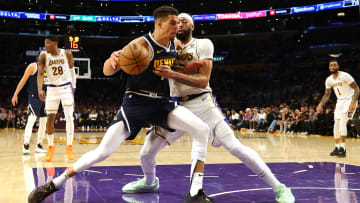 Apr 27, 2024; Los Angeles, California, USA; Denver Nuggets forward Michael Porter Jr. (1) battles for position with Los Angeles Lakers forward Anthony Davis (3) during the third quarter in game four of the first round for the 2024 NBA playoffs at Crypto.com Arena. Mandatory Credit: Jason Parkhurst-USA TODAY Sports