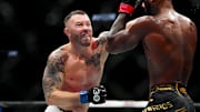 Dec 16, 2023; Las Vegas, Nevada, USA; Leon Edwards (red gloves) fights Colby Covington (blue gloves) during UFC 296 at T-Mobile Arena. Mandatory Credit: Stephen R. Sylvanie-Imagn Images