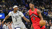 Mar 2, 2025; Orlando, Florida, USA; Toronto Raptors guard RJ Barrett (9) drives around Orlando Magic guard Kentavious Caldwell-Pope (3) during the second half at Kia Center. Mandatory Credit: Mike Watters-Imagn Images