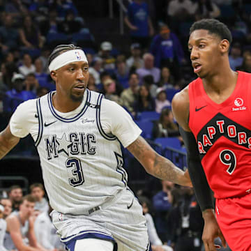 Mar 2, 2025; Orlando, Florida, USA; Toronto Raptors guard RJ Barrett (9) drives around Orlando Magic guard Kentavious Caldwell-Pope (3) during the second half at Kia Center. Mandatory Credit: Mike Watters-Imagn Images