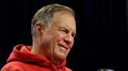 Bill Belichick smiles during questions at a press conference.