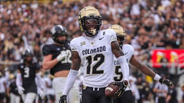 Sep 28, 2024; Orlando, Florida, USA; Colorado Buffaloes wide receiver Travis Hunter (12) scores a touchdown against the UCF Knights during the first quarter at FBC Mortgage Stadium. 