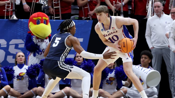 Mar 21, 2024; Salt Lake City, UT, USA; Kansas Jayhawks guard Johnny Furphy (10) looks to pass against Samford Bulldogs guard A.J. Staton-McCray (5) during the second half in the first round of the 2024 NCAA Tournament at Vivint Smart Home Arena-Delta Center. Mandatory Credit: Rob Gray-USA TODAY Sports