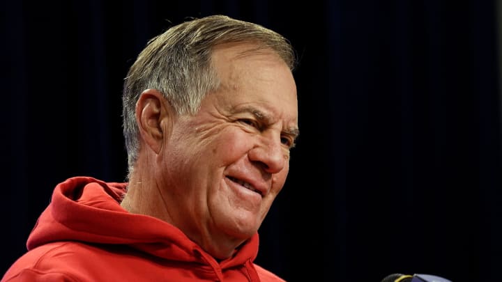 Bill Belichick smiles during questions at a press conference.