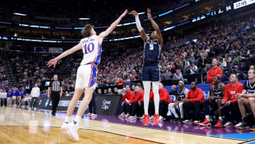 Mar 21, 2024; Salt Lake City, UT, USA; Samford Bulldogs guard A.J. Staton-McCray (5) shoots against Kansas Jayhawks guard Johnny Furphy (10) during the second half in the first round of the 2024 NCAA Tournament at Vivint Smart Home Arena-Delta Center. Mandatory Credit: Rob Gray-USA TODAY Sports