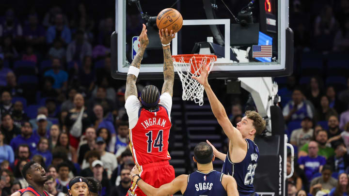 Mar 21, 2024; Orlando, Florida, USA; New Orleans Pelicans forward Brandon Ingram (14) shoots the ball against Orlando Magic forward Franz Wagner (22) during the first quarter at KIA Center