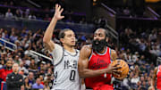 Mar 31, 2025; Orlando, Florida, USA; LA Clippers guard James Harden (1) drives against Orlando Magic guard Anthony Black (0) during the second half at Kia Center. Mandatory Credit: Mike Watters-Imagn Images