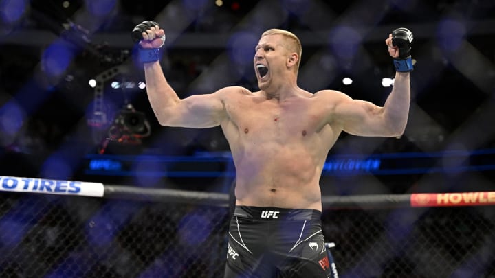 Jul 30, 2022; Dallas, TX, USA; Sergei Pavlovich (blue gloves) reacts after defeating Derrick Lewis (not pictured) in a heavyweight bout during UFC 277 at the American Airlines Center. Mandatory Credit: Jerome Miron-USA TODAY Sports