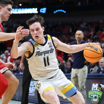 Mar 29, 2024; Dallas, TX, USA; Marquette Golden Eagles guard Tyler Kolek (11) dribble against North Carolina State Wolfpack guard Michael O'Connell (12) during the second half in the semifinals of the South Regional of the 2024 NCAA Tournament at American Airlines Center. Mandatory Credit: Tim Heitman-USA TODAY Sports 