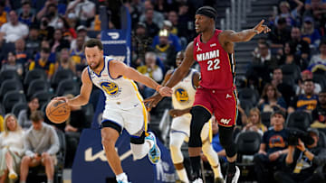 Oct 27, 2022; San Francisco, California, USA; Golden State Warriors guard Stephen Curry (30) dribbles past Miami Heat forward Jimmy Butler (22) in the third quarter at the Chase Center. Mandatory Credit: Cary Edmondson-Imagn Images
