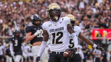 Sep 28, 2024; Orlando, Florida, USA; Colorado Buffaloes wide receiver Travis Hunter (12) scores a touchdown against the UCF Knights during the first quarter at FBC Mortgage Stadium. Mandatory Credit: Mike Watters-Imagn Images