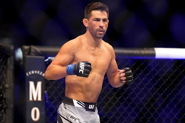 Dominick Cruz (Blue Gloves) fights against Marlon Vera (not shown) during the UFC fight night in the Pechanga Arena. 