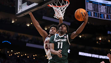Mar 30, 2025; Atlanta, GA, USA; Michigan State Spartans guard Jase Richardson (11) shoots against Auburn Tigers center Dylan Cardwell (44) during the second half in the South Regional final of the 2025 NCAA tournament at State Farm Arena. Mandatory Credit: Brett Davis-Imagn Images