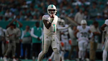 Dec 8, 2024; Miami Gardens, Florida, USA; Miami Dolphins quarterback Tua Tagovailoa (1) looks on from the field against the New York Jets during the fourth quarter at Hard Rock Stadium. Mandatory Credit: Sam Navarro-Imagn Images