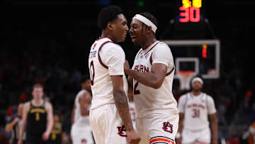 Mar 28, 2025; Atlanta, GA, USA; Auburn Tigers guard Denver Jones (2) celebrates with guard Tahaad Pettiford (0) after a basket in the second half of a South Regional semifinal of the 2025 NCAA tournament against the Michigan Wolverines at State Farm Arena. Mandatory Credit: Brett Davis-Imagn Images
