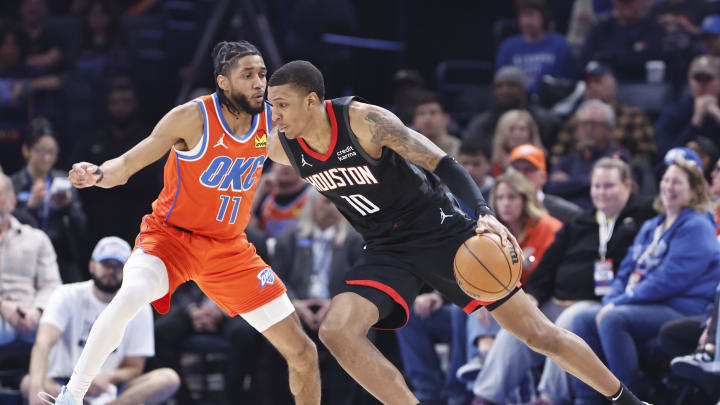 Mar 27, 2024; Oklahoma City, Oklahoma, USA; Houston Rockets forward Jabari Smith Jr. (10) drives past Oklahoma City Thunder guard Isaiah Joe (11) during the second quarter at Paycom Center. Mandatory Credit: Alonzo Adams-USA TODAY Sports