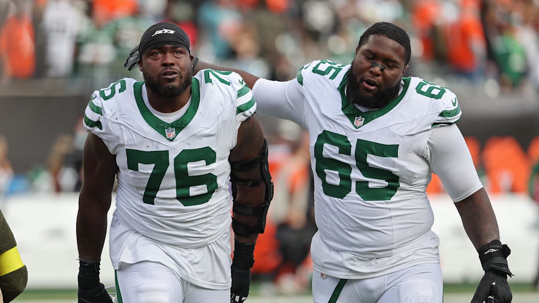 Oct 26, 2025; Cincinnati, Ohio, USA; New York Jets guard John Simpson (76) and guard Xavier Newman (65) walks off the court after winning the game against the Cincinnati Bengals at Paycor Stadium. Mandatory Credit: Joseph Maiorana-Imagn Images Oct 26, 2025; Cincinnati, Ohio, USA; New York Jets guard John Simpson (76) and guard Xavier Newman (65) walks off the court after winning the game against the Cincinnati Bengals at Paycor Stadium. Mandatory Credit: Joseph Maiorana-Imagn Images