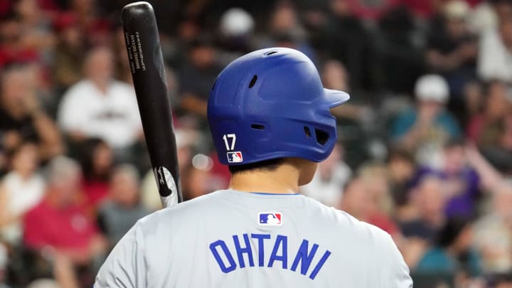 Sep 1, 2024; Phoenix, Arizona, USA; Los Angeles Dodgers two-way player Shohei Ohtani (17) looks on against the Arizona Diamondbacks during the second inning at Chase Field