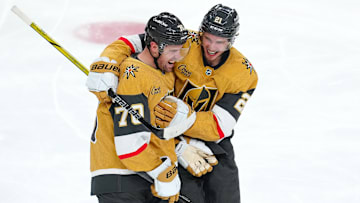 Apr 29, 2025; Las Vegas, Nevada, USA; Vegas Golden Knights center Brett Howden (21) celebrates with Vegas Golden Knights left wing Tanner Pearson (70) after scoring a goal in an overtime period to give the Golden Knights a 3-2 victory over the Minnesota Wild in game five of the first round of the 2025 Stanley Cup Playoffs at T-Mobile Arena. Mandatory Credit: Stephen R. Sylvanie-Imagn Images