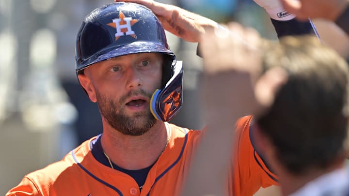 Houston Astros first baseman Christian Walker (8) is greeted in the dugout after hitting a solo home run in the eighth inning against the Los Angeles Dodgers at Dodger Stadium.