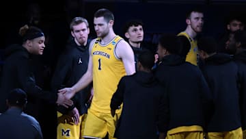 Mar 28, 2021; Indianapolis, IN, USA; Michigan Wolverines center Hunter Dickinson (1) reacts during