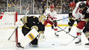 Apr 9, 2024; Boston, Massachusetts, USA; Carolina Hurricanes left wing Teuvo Teravainen (86) looks for a loose puck in front of Boston Bruins goaltender Jeremy Swayman (1) during the second period at TD Garden. Mandatory Credit: Bob DeChiara-Imagn Images