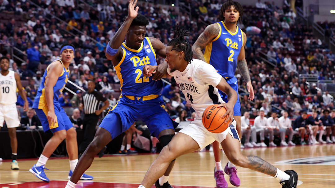 Dec 21, 2025; Hershey, Pennsylvania, USA; Penn State Nittany Lions guard Kayden Mingo (4) drives the ball to the basket as Pittsburgh Panthers guard/forward Barry Dunning Jr (22) defends during the first half at Giant Center. Mandatory Credit: Matthew O'Haren-Imagn Images Dec 21, 2025; Hershey, Pennsylvania, USA; Penn State Nittany Lions guard Kayden Mingo (4) drives the ball to the basket as Pittsburgh Panthers guard/forward Barry Dunning Jr (22) defends during the first half at Giant Center. Mandatory Credit: Matthew O'Haren-Imagn Images