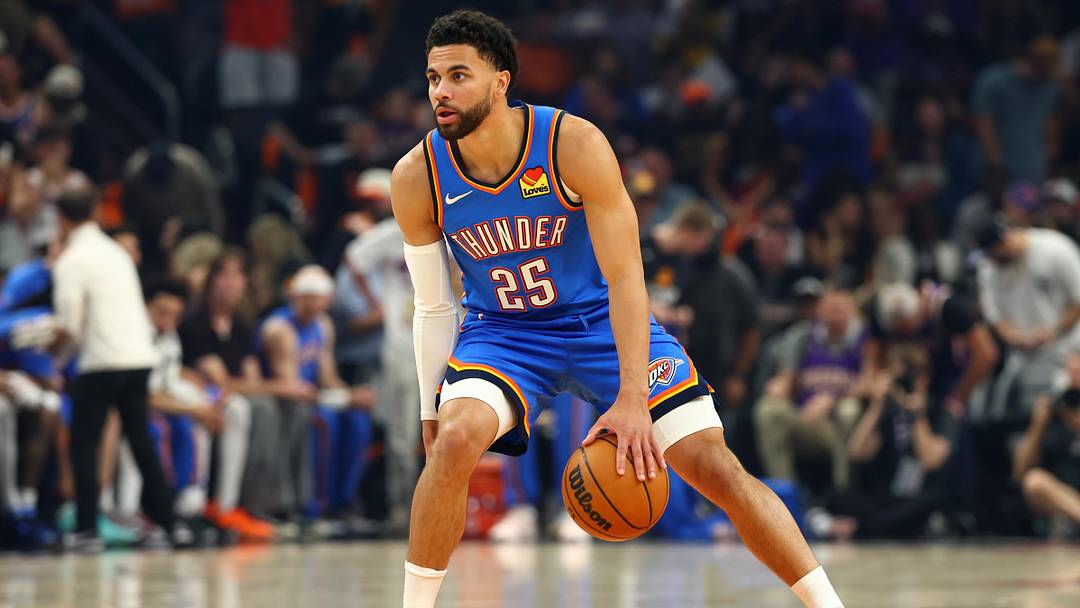 Apr 27, 2026; Phoenix, Arizona, USA; Oklahoma City Thunder guard Ajay Mitchell (25) against the Phoenix Suns during game four of the first round of the 2026 NBA Playoffs at Mortgage Matchup Center. Mandatory Credit: Mark J. Rebilas-Imagn Images
