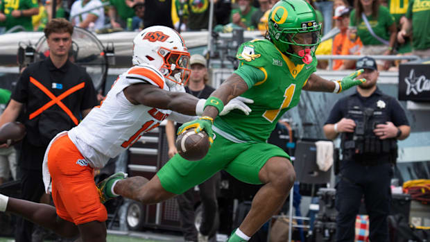 dan lanning oregon ducks northwestern wildcats oklahoma state cowboys dante moore quarterback running backs wide receiver