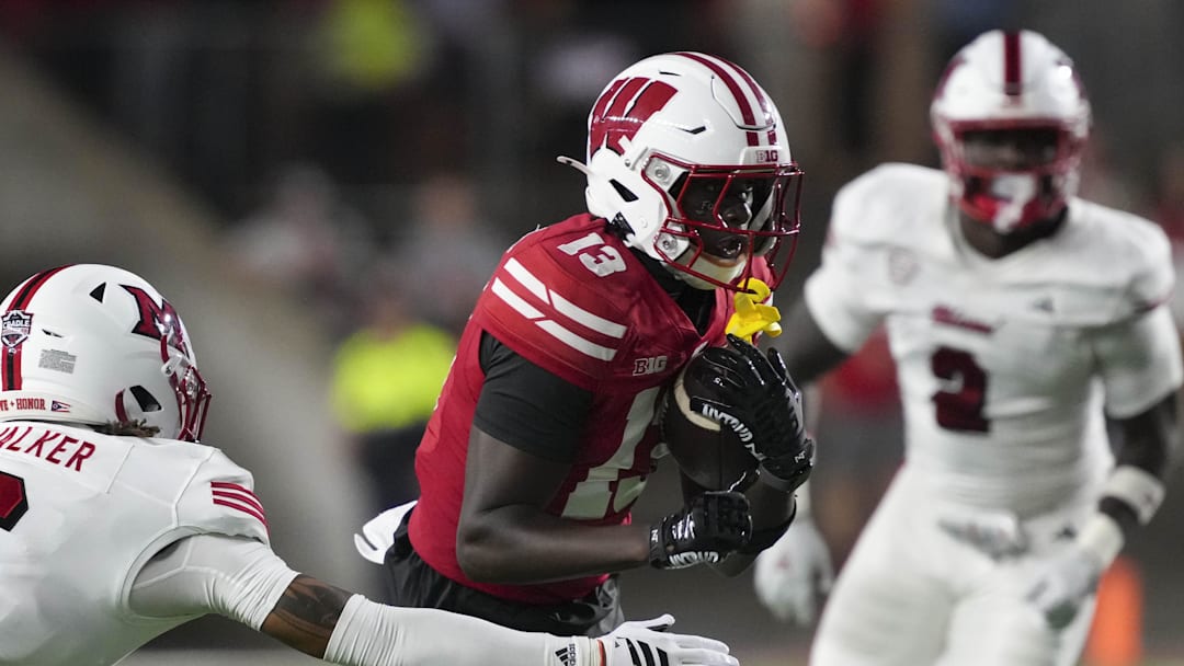 Wisconsin Badgers wide receiver Eugene Hilton Jr. (13) will return to Madison after initially entering the transfer portal.