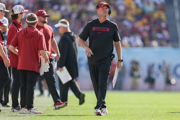 Alabama Crimson Tide head coach Kalen Deboer looks on against the Michigan Wolverines.