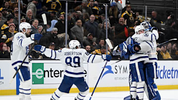 Feb 25, 2025; Boston, Massachusetts, USA; Toronto Maple Leafs right wing Mitch Marner (16) celebrates with his teammates after scoring the game winning goal against the Boston Bruins during an overtime period at the TD Garden. Mandatory Credit: Brian Fluharty-Imagn Images