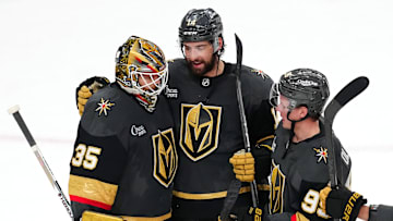 Mar 23, 2025; Las Vegas, Nevada, USA; Vegas Golden Knights goaltender Ilya Samsonov (35) is congratulated by defenseman Nicolas Hague (14) and  right wing Victor Olofsson (95) after defeating the Tampa Bay Lightning 4-2 at T-Mobile Arena. Mandatory Credit: Stephen R. Sylvanie-Imagn Images