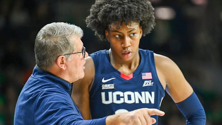 Dec 4, 2022; South Bend, Indiana, USA; Connecticut Huskies head coach Geno Auriemma talks to forward Ayanna Patterson (34) in the second half against the Notre Dame Fighting Irish at the Purcell Pavilion. Mandatory Credit: Matt Cashore-Imagn Images