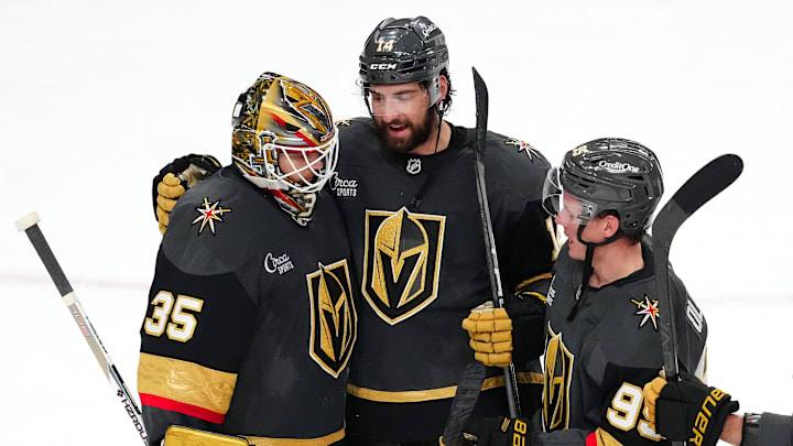 Mar 23, 2025; Las Vegas, Nevada, USA; Vegas Golden Knights goaltender Ilya Samsonov (35) is congratulated by defenseman Nicolas Hague (14) and  right wing Victor Olofsson (95) after defeating the Tampa Bay Lightning 4-2 at T-Mobile Arena. Mandatory Credit: Stephen R. Sylvanie-Imagn Images