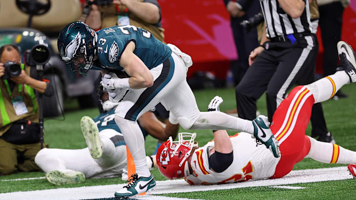 Philadelphia Eagles cornerback Cooper DeJean (33) scores a touchdown after making an interception against the Kansas City Chiefs during the first half of Super Bowl LIX at Caesars Superdome. 