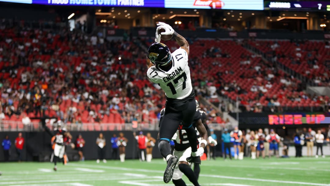 Aug 23, 2024; Atlanta, Georgia, USA; Jacksonville Jaguars tight end Evan Engram (17) catches a touchdown pass past Atlanta Falcons cornerback Anthony Johnson (43) in the second quarter at Mercedes-Benz Stadium. Mandatory Credit: Brett Davis-USA TODAY Sports
